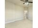 Bright bedroom features neutral paint and carpet, ceiling fan, and an open door to the hallway at 1013 Timber Mist Ct, Cary, NC 27519