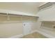 A closet with carpet, storage shelves and a small doorway for storage at 1013 Timber Mist Ct, Cary, NC 27519