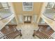 View of a grand foyer with a dual staircase, high ceilings, and elegant finishes at 1013 Timber Mist Ct, Cary, NC 27519