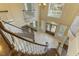 Bright foyer features a winding staircase, tile flooring, and large windows, offering an inviting entrance at 1013 Timber Mist Ct, Cary, NC 27519