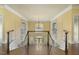 Spacious foyer with hardwood floors and staircase leading to the upper level at 1013 Timber Mist Ct, Cary, NC 27519