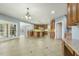 Open concept living with a gourmet kitchen, granite countertops, and ample cabinet space at 1013 Timber Mist Ct, Cary, NC 27519