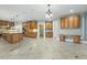 Open great room featuring a spacious kitchen with custom cabinets and lots of light at 1013 Timber Mist Ct, Cary, NC 27519