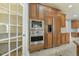 Custom kitchen with stainless steel appliances, a built-in refrigerator, and ample cabinet space at 1013 Timber Mist Ct, Cary, NC 27519