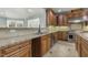 Gourmet kitchen features custom cabinets, stainless steel appliances, and granite countertops at 1013 Timber Mist Ct, Cary, NC 27519