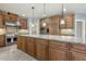 Expansive kitchen features a large island with granite countertops and stainless steel appliances at 1013 Timber Mist Ct, Cary, NC 27519