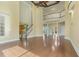 Open-concept living room with high ceilings, wood floors, and a balcony overlooking the space at 1013 Timber Mist Ct, Cary, NC 27519