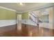 The hardwood floors and wainscoting are the stars of this formal living room at 1013 Timber Mist Ct, Cary, NC 27519