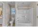 Bathroom with a standard toilet, tub and shower combination, and a small window for natural light at 1031 Wait Ave, Wake Forest, NC 27587