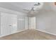 Bedroom with neutral carpet and multiple closets and doors providing ample storage at 1031 Wait Ave, Wake Forest, NC 27587