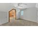 Spacious bedroom with a ceiling fan and a walk-in closet with wooden features at 1031 Wait Ave, Wake Forest, NC 27587