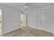 Bright bedroom featuring a ceiling fan, a closet, and a doorway leading to a bathroom at 1031 Wait Ave, Wake Forest, NC 27587