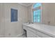 Functional laundry room with sink, storage, and natural light from the large window at 1031 Wait Ave, Wake Forest, NC 27587