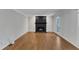 Bright living room featuring hardwood floors and a traditional black fireplace at 1031 Wait Ave, Wake Forest, NC 27587