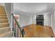 Inviting living room with hardwood floors and a classic black fireplace at 1031 Wait Ave, Wake Forest, NC 27587