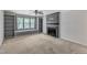 This living room features a fireplace, built-in shelving, and a large window at 1031 Wait Ave, Wake Forest, NC 27587