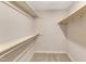 This walk-in closet features carpet and shelving at 1031 Wait Ave, Wake Forest, NC 27587