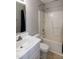 Bathroom features a shower-tub combination and a vanity with a sink at 104 Eddy Ct, Benson, NC 27504