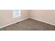 Bedroom featuring neutral paint, carpeted floor, and natural light from window at 104 Eddy Ct, Benson, NC 27504