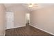 Bedroom featuring ceiling fan, hardwood floors, and en-suite bathroom at 104 Eddy Ct, Benson, NC 27504