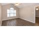 Spacious bedroom featuring ceiling fan and hardwood floors at 104 Eddy Ct, Benson, NC 27504