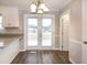 The open-concept kitchen and dining area with access to the back patio at 104 Eddy Ct, Benson, NC 27504