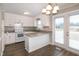 Bright kitchen with white cabinets, modern countertops, and stainless steel appliances at 104 Eddy Ct, Benson, NC 27504
