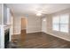 Living room with a red front door, fireplace, neutral colors and new flooring at 104 Eddy Ct, Benson, NC 27504