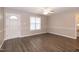 Inviting living room with natural light, fan, and neutral wall color, ideal for relaxation at 104 Eddy Ct, Benson, NC 27504