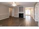 Inviting living room with a fireplace and elegant mantle, showcasing an open floor plan at 104 Eddy Ct, Benson, NC 27504