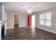 Bright living room with modern flooring, fireplace, and a red front door at 104 Eddy Ct, Benson, NC 27504