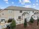 Townhouse back exterior with fenced yard, patio, and maintained landscaping at 11425 Shadow Elms Ln, Raleigh, NC 27614