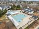 Community pool features a large swimming area with a slide and clubhouse at 11425 Shadow Elms Ln, Raleigh, NC 27614