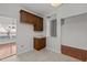 Functional kitchen area featuring wooden cabinets, tile floors, and seamless access to adjacent rooms at 11425 Shadow Elms Ln, Raleigh, NC 27614