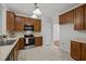 Practical kitchen featuring ample cabinet space, modern appliances, and easy access to dining area for convenience at 11425 Shadow Elms Ln, Raleigh, NC 27614