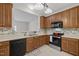 Efficient kitchen boasting wood cabinets, modern appliances, and an open layout for seamless cooking experiences at 11425 Shadow Elms Ln, Raleigh, NC 27614