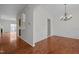 Open-concept layout showing seamless transition from living area with hardwood floors to other parts of the house at 11425 Shadow Elms Ln, Raleigh, NC 27614