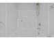 A clean, white shower-tub combo provides a bright, functional space in this home's well-kept bathroom at 11425 Shadow Elms Ln, Raleigh, NC 27614