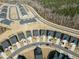 Aerial view of a planned community with homes and winding roads in a wooded setting at 1255 White Flint Cir, Durham, NC 27703