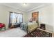 Inviting bedroom featuring tray ceilings, carpet floors, a large window and a tapestry on the wall at 1255 White Flint Cir, Durham, NC 27703
