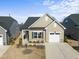 Single-Gathering home with a well-manicured lawn, attached garage, and neutral trim at 1255 White Flint Cir, Durham, NC 27703