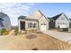 Attractive single Gathering home with stone accents, an attached garage, and manicured landscaping at 1255 White Flint Cir, Durham, NC 27703