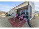 Relaxing screened patio with cozy rocking chairs, perfect for enjoying the outdoors at 1255 White Flint Cir, Durham, NC 27703