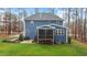 The backyard has a deck and a small patio area, and the house is blue at 130 Willow Bend Dr, Youngsville, NC 27596
