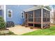 Screened-in back porch with a patio featuring a grill and nice backyard at 130 Willow Bend Dr, Youngsville, NC 27596