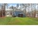 Home exterior showcasing a screened-in porch and sprawling yard, perfect for outdoor living at 130 Willow Bend Dr, Youngsville, NC 27596