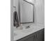 Bathroom featuring a gray vanity with white marble countertop, a modern sink, and a large mirror at 130 Willow Bend Dr, Youngsville, NC 27596