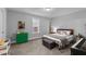 Bedroom featuring a queen bed, carpet, and a colorful green dresser at 130 Willow Bend Dr, Youngsville, NC 27596