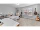 Comfortable bedroom with natural light, decorated with guitars, a desk and a dresser at 130 Willow Bend Dr, Youngsville, NC 27596