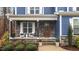 Inviting front porch features stone accents, seating, and a decorative front door at 130 Willow Bend Dr, Youngsville, NC 27596